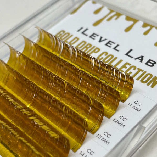 gold tinsel lashes, tinsel lashes, tinsel lash extensions, gold lashes, festival lashes, colored lashes, holographic lashes